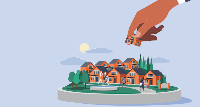 illustration of hand placing house in neighborhood