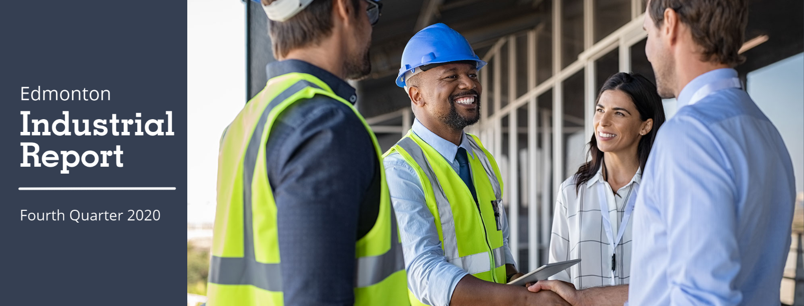 professionals wearing safety vests shake hands with other professionals