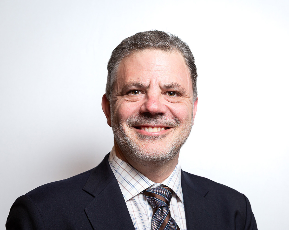 Headshot de Tom Bruister, directeur et directeur principal des services d'occupation en Amérique du Nord pour Avison Young