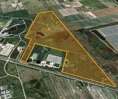 aerial view of Avison Young's $17.5M sale of ±606-acre industrial development site near Florida Commerce Park