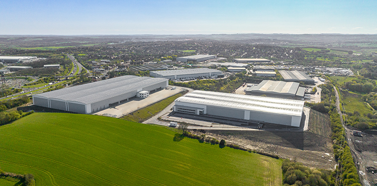 An aerial image of a group of large industrial warehouse buildings