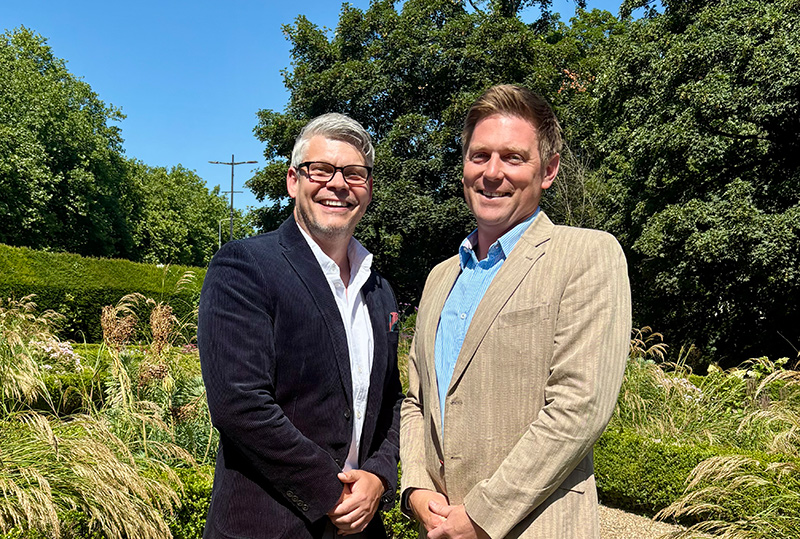 A portrait image of John Coggins with Andrew Gibson